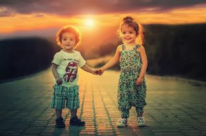 children holding hands sunset 1920